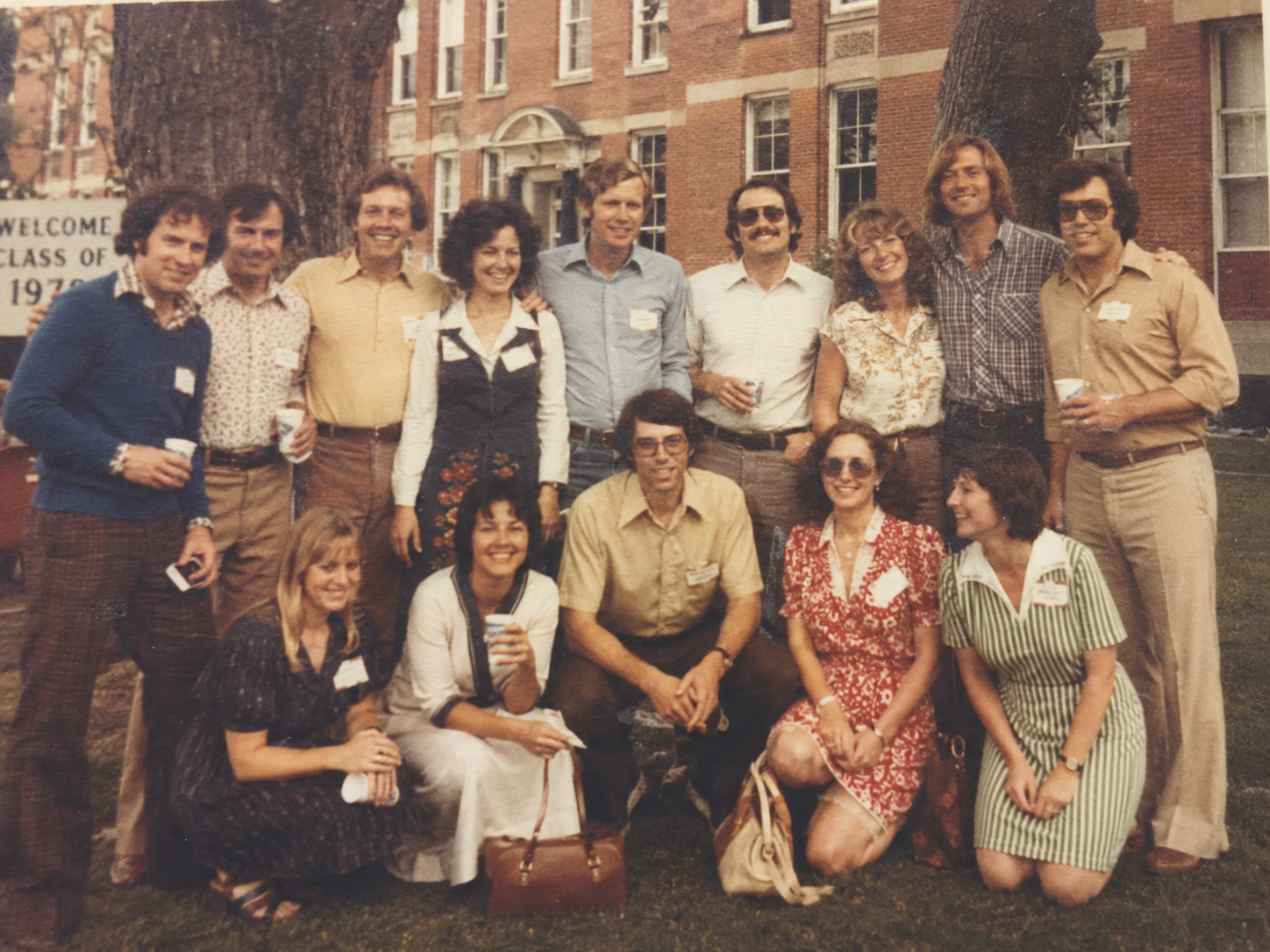 A faded 1979 class-reunion group photo before restoration