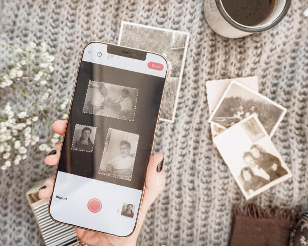 Photomyne detecting several old printed photos at once on a phone screen